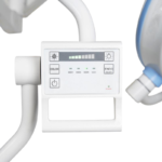 Close-up of a dental imaging device's control panel mounted on a white stand with arms visible behind it