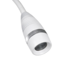 Close-up of a white flexible hose or cable end with a metal ring and an open threaded tip revealing an inner cavity