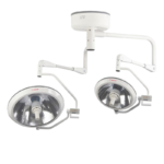 Ceiling-mounted surgical lights with two round lamp heads on articulated arms in an operating room