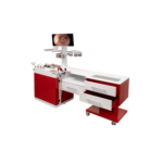Red-and-white medical instrument cart with several drawers and an overhead monitor showing a close-up of an ear.